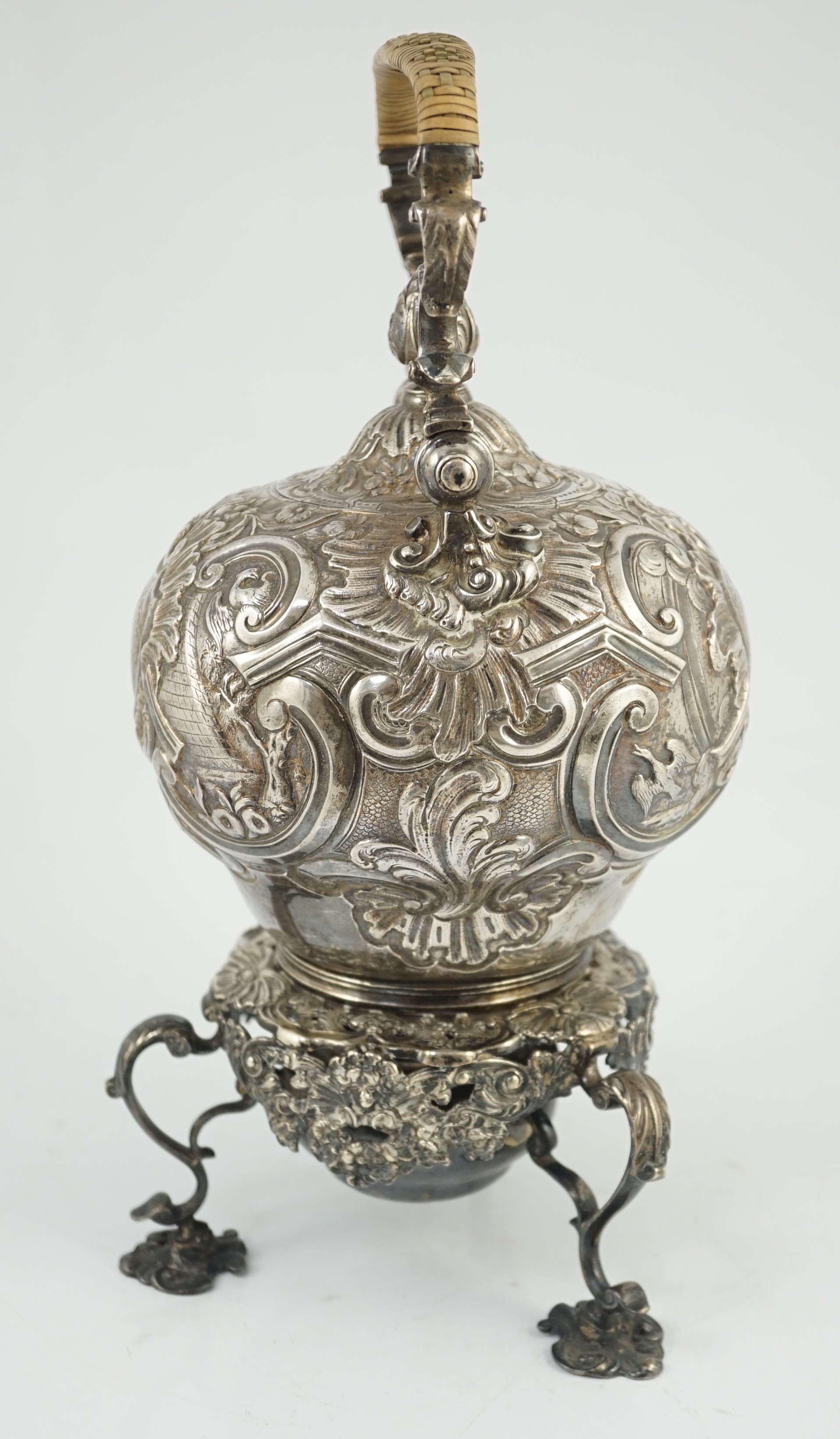 A George II embossed silver tea kettle on stand, with burner, by Francis Crump